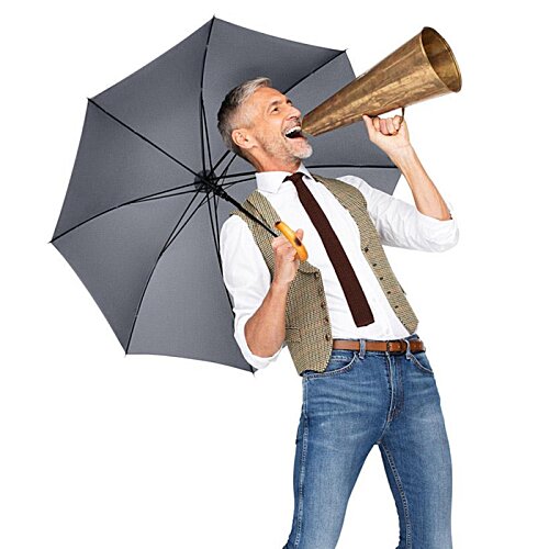 Additional Image 5 - a man holding an umbrella and speaking into a megaphone