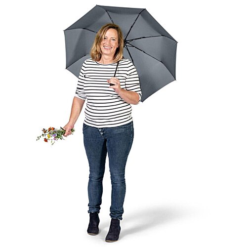 Additional Image 3 - a woman holding an umbrella