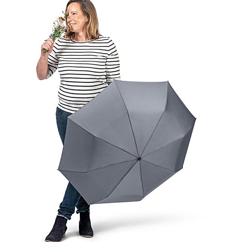 Additional Image 4 - a woman holding an umbrella