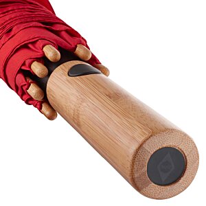 Additional Image 3 - a hand holding a wooden bat
