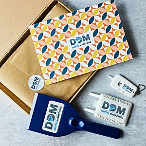 Additional Image 3 - a blue and orange box with a blue object next to a brown envelope