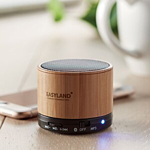 Additional Image 1 - a round wooden speaker on a table