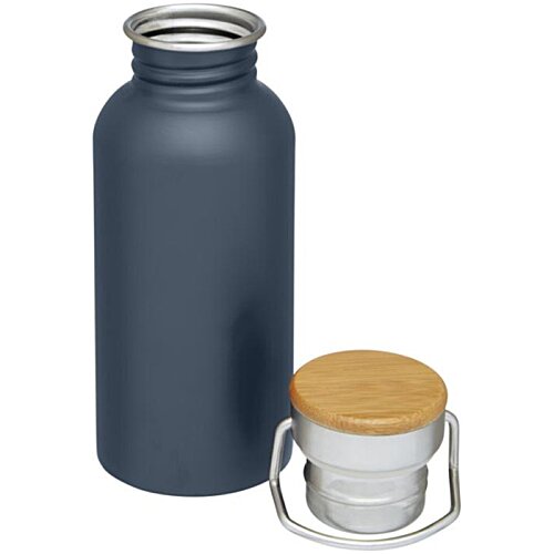 Additional Image 4 - a black bottle with a white container