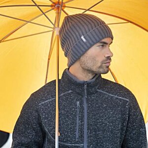 Additional Image 3 - a man wearing a hat and standing under an umbrella