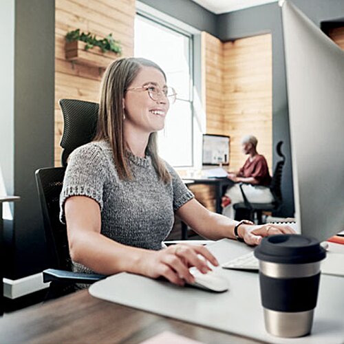 Additional Image 6 - a woman sitting at a desk
