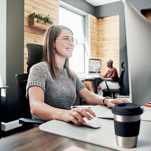 Additional Image 6 - a woman sitting at a desk