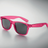 a pink sunglasses on a white surface