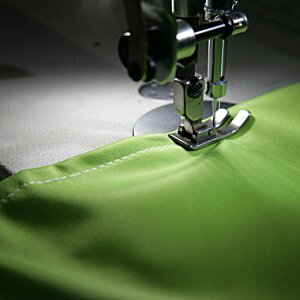 Additional Image 3 - a sewing machine with green fabric