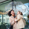 Additional Thumbnail Image 9 - a woman holding a child under an umbrella