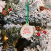 a christmas tree with a ornament from it