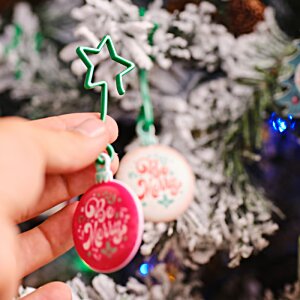 Additional Image 3 - a hand holding a christmas ornament