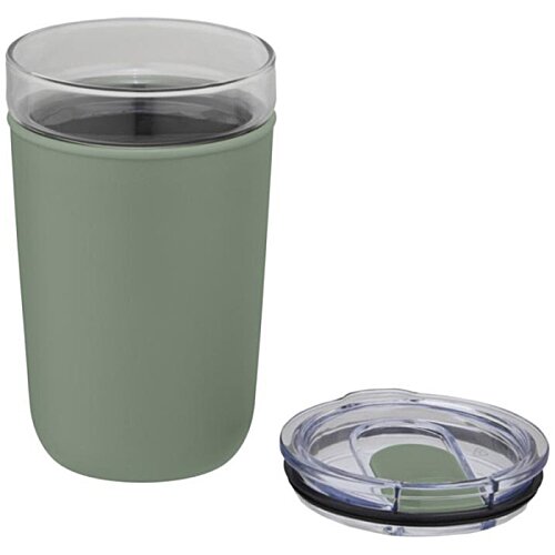 Additional Image 1 - a glass with liquid in it next to a small round object