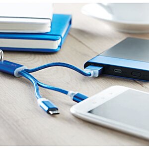 Additional Image 4 - a phone and a charger on a table