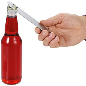 Additional Image 2 - a hand holding a knife over a bottle