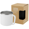 a white mug with a handle and a box