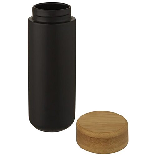 Additional Image 4 - a black bottle with a brown cap