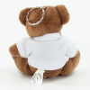 a stuffed bear wearing a white shirt