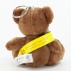 a stuffed bear with a yellow band around its neck