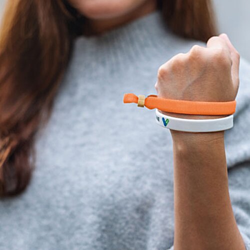 Additional Image 11 - a woman wearing a grey shirt and holding a toothbrush
