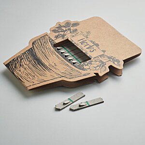 Additional Image 3 - a brown object with a few small objects on it