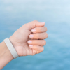 Additional Image 4 - a hand with a white wristband