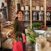 Additional Thumbnail Image 12 - a woman holding a bag in a grocery store
