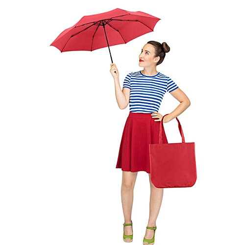 Additional Image 11 - a woman holding an umbrella and a bag