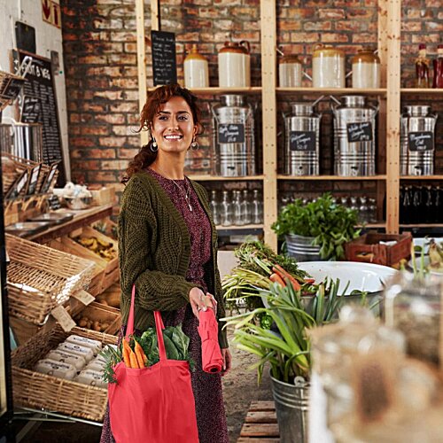 Additional Image 12 - a woman holding a bag in a grocery store