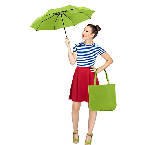 Additional Image 13 - a woman holding an umbrella