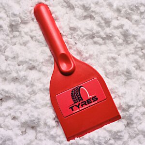 Additional Image 1 - a red plastic spatula on a white surface