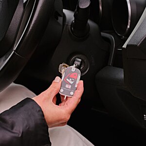 Additional Image 1 - a person holding a key in a car