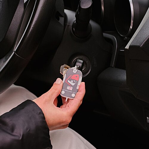 Additional Image 1 - a person holding a key in a car