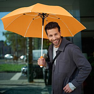 Additional Image 12 - a man holding an umbrella