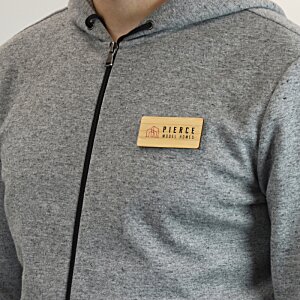 Additional Image 1 - a person wearing a grey jacket with a name tag
