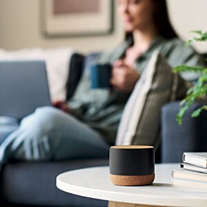 Additional Image 5 - a woman sitting on a couch holding a cup