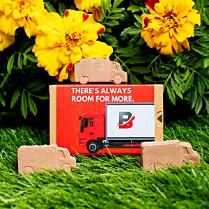 Additional Image 7 - a red sign with a picture on it next to yellow flowers