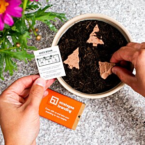 Additional Image 3 - a person's hands holding a piece of paper next to a potted plant