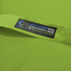 a green shirt with a label