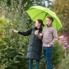 a man and woman standing under an umbrella