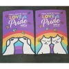 a book with a rainbow and cats