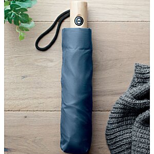 Additional Image 6 - a blue umbrella on a wooden surface