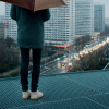 a person holding a box over their head