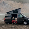 a couple of people sitting in a van