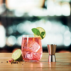 Additional Image 4 - a glass of red liquid with ice and a slice of lime on a wooden surface