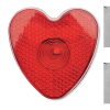 a red heart shaped object with a hole in the middle