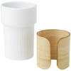 a white cup and a wooden container