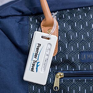 Additional Image 1 - a hand holding a luggage tag