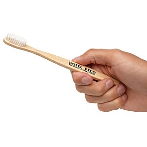 Additional Image 3 - a hand holding a toothbrush