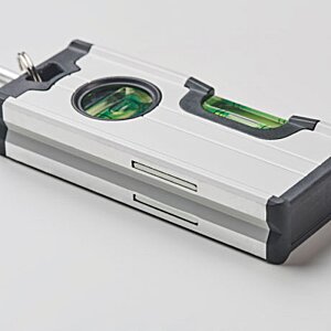 Additional Image 3 - a silver rectangular object with a green circle