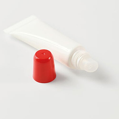 Additional Image 1 - a white tube with a red cap